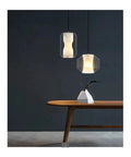 Modern Clear Glass Pendant Light with Marble Pattern Inner Shade, Adjustable Suspended Hanging for Kitchen Island,Warmth above wooden table.