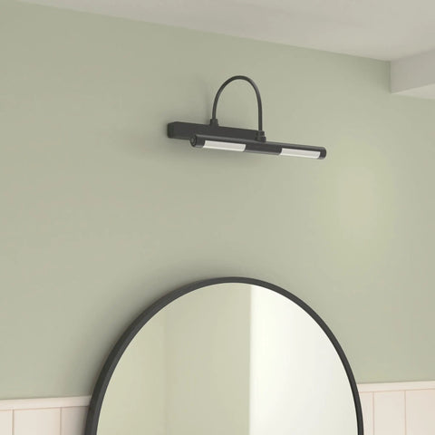 Rechargeable Picture Light With Remote For Paintings And Wall Art, mounted above a mirror, in use, black finish, gallery lighting