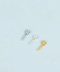 Three assorted sheep eye screws in silver and gold from the 600-Piece Sheep Eye Screw Kit With Plated Iron Round Eye Hooks And Self-Tapping Screws.
