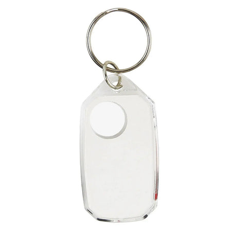 Clear keychain tag with rounded corners and metal ring attachment, representing compact design for durable ABS compass keychain.