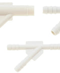 Five white plastic vacuum tubing Y-tee connectors with barbed ends, assorted sizes for automotive vacuum systems.
