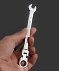 Hand holding Workhorse Ratchet Socket Wrench Set With Spanners, chrome-vanadium, adjustable, compact for car repair in tight spaces.