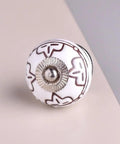 Top Shelf 50 Piece Ceramic Drawer Knobs And Door Pulls Featuring Sweet Etched Floral Designs For Kitchen Cabinets And Dressers With Ace Cream Finish And Hella Tough Build That Definitely Slays Hard, close-up of cream knob.