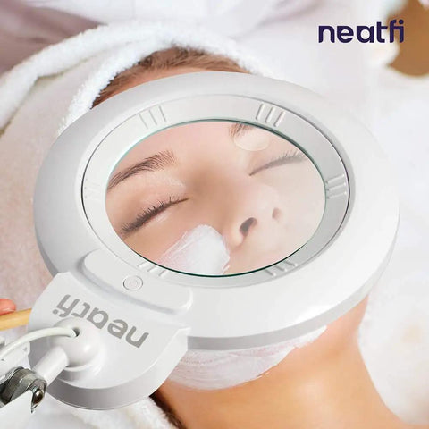 XL Bifocals 1200 Lumens LED Magnifying Lamp With Clamp, 3 Light Modes, showing hands-free use during skincare treatment