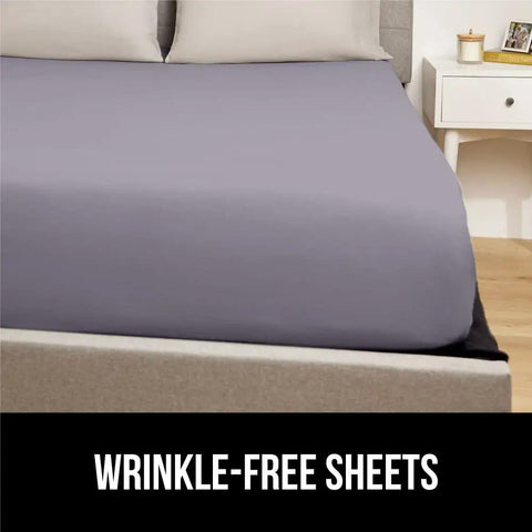 Patented Bed Sheet Holders With Adjustable Elastic Straps And Metal Clips That Stay Put And Keep Fitted Sheets Locked In Place Night After Night Heavy Duty 4 Pack White US Designed To Fit Any Mattress shown with wrinkle-free sheet