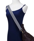 Upgrade Your Daily Carry With This Wide Adjustable Jacquard Crossbody Strap For Women Featuring Gold Hardware And A Bold Diagonal Weave Design That Truly Makes Your Favorite Handbags Look Fresh And Ready To Flex Anywhere You Go Today on a model with a dark handbag.