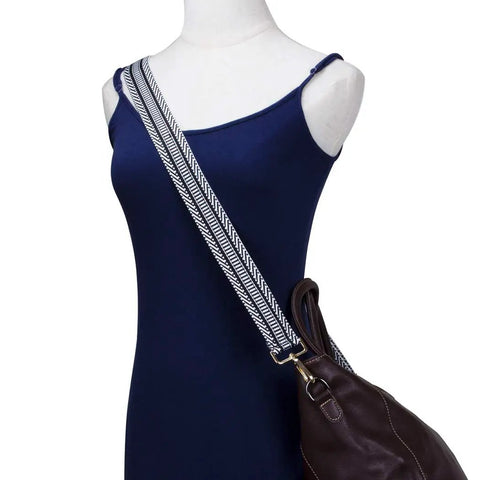 Upgrade Your Daily Carry With This Wide Adjustable Jacquard Crossbody Strap For Women Featuring Gold Hardware And A Bold Diagonal Weave Design That Truly Makes Your Favorite Handbags Look Fresh And Ready To Flex Anywhere You Go Today on a model with a dark handbag.