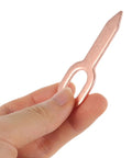 Hand holding a single iron dent puller washer from Dent Repair Kit With 200 Pcs Iron Dent Puller Washers For Auto Body Sheet Metal Repair Alignment