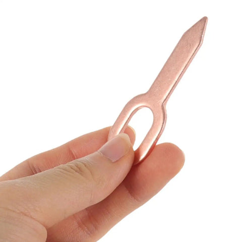 Hand holding a single iron dent puller washer from Dent Repair Kit With 200 Pcs Iron Dent Puller Washers For Auto Body Sheet Metal Repair Alignment