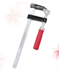 Heavy Duty Woodworking Clamps Set For Fastening Pliers And Quick Clamps Your Go To Tool For Industrial And Crafts Durable Steel Clips Simple To Use And Built To Last For Secure Woodworking Projects, showing a single F-clamp with red handle and steel bar on floral background.