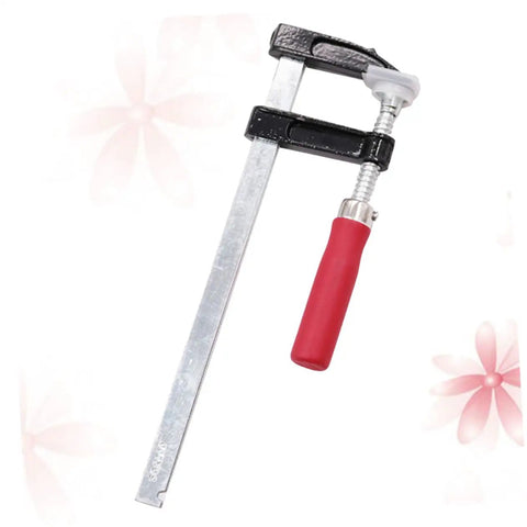 Heavy Duty Woodworking Clamps Set For Fastening Pliers And Quick Clamps Your Go To Tool For Industrial And Crafts Durable Steel Clips Simple To Use And Built To Last For Secure Woodworking Projects, showing a single F-clamp with red handle and steel bar on floral background.