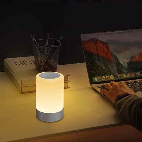 Nursery Night Light For Baby With Dimmable Brightness And Easy Touch Control on wooden desk near laptop and book