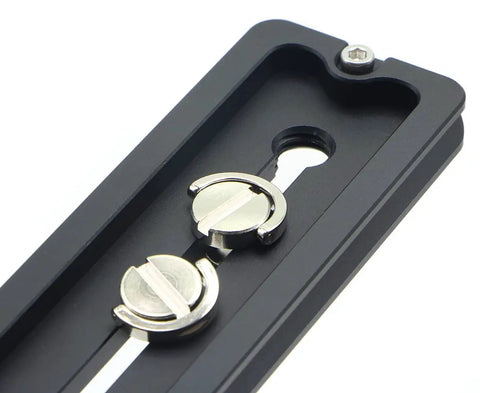Close-up of 150mm universal quick release plate with 1/4 and 3/8 inch mounting screws, Arca-Swiss compatible lightweight aluminum.