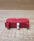 Straight Up Heavy Duty 10 Amp 22 Mm 600 Vac Contact Block Featuring Normally Closed Contacts And Vibrant Red Housing on wooden surface.