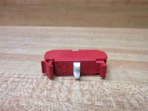 Straight Up Heavy Duty 10 Amp 22 Mm 600 Vac Contact Block Featuring Normally Closed Contacts And Vibrant Red Housing on wooden surface.