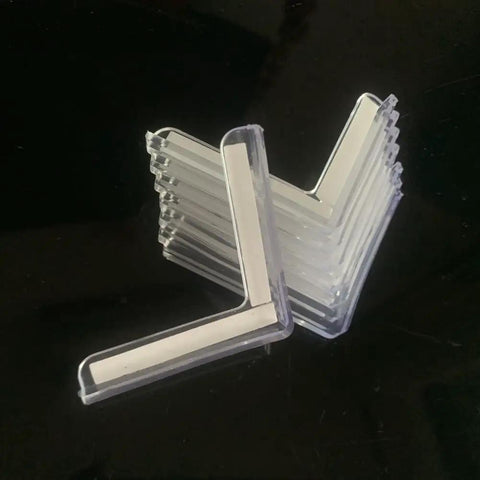 Top Shelf Clear PVC Corner Guards 8 Pack L Shaped Protective Bumpers For Tables And Doors Transparent stacked on a black surface.