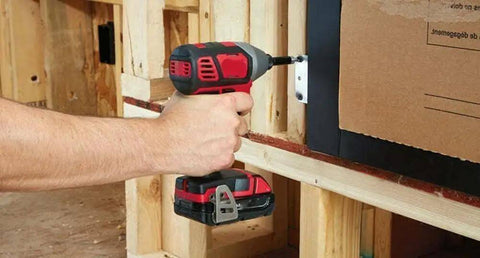 Heavy Duty 18 Volt Cordless Rig Showcasing A Boss Level Half Inch Drill in use fastening drywall to framing.