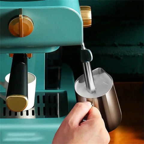 Electric Coffee Maker With Auto Milk Frother For Smooth Cappuccino Sips in use with steaming milk pitcher.