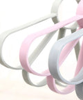 Fan Shaped Closet Rod Organizer For Ties Scarves And Hats Made From Sturdy Polypropylene in soft pink and gray colors.