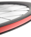 Close-up of Ultra Light 700C Road Bike Carbon Clincher Wheelset with 38mm Depth, basalt brake surface visible, Toray T700.