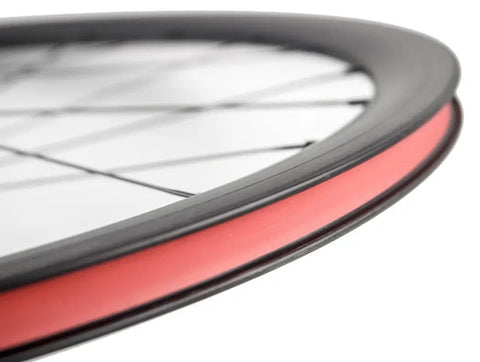 Close-up of Ultra Light 700C Road Bike Carbon Clincher Wheelset with 38mm Depth, basalt brake surface visible, Toray T700.