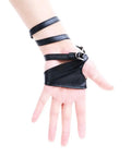 Dope Women Fingerless Gloves Crafted From Supple Faux Pu Leather For Nightouts And Punk Scenes Ultra Flexible Half Palm Wrist Cuff In Classic Matte Black Finish on a hand with straps.