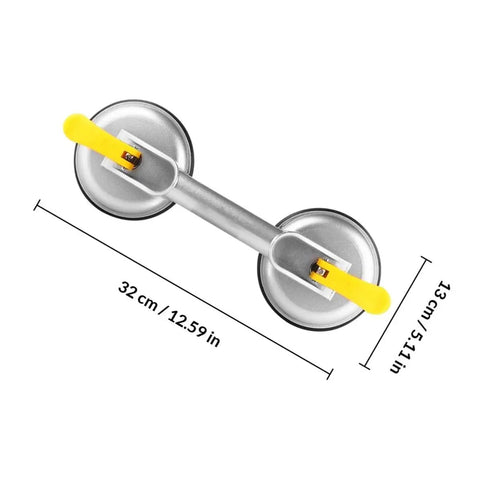 Super Heavy Duty 2 Jaw Glass Suction Cup Lifter Tool With Spring Loaded Locking Handle showing dimensions of 32 cm by 13 cm, aluminum and rubber construction.