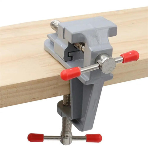 Grab N Go Portable Table Vise Clamp for workbench, securing wood with swivel feature, lightweight compact bench tool.