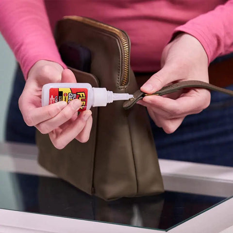 Crystal Clear Super Glue Instant Bond Adhesive Hella Tough 20 Gram Bottle With Precision Tip Applicator for fixing a purse strap.