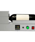 Electric PVC Wine Bottle Capsule Heat Shrinker with wine bottle on tabletop, illustrating shrink sleeve sealing process.
