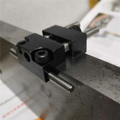 Close-up view of Badass Strength Precision Vise Stop Locators for CNC Milling Machines on a metal surface.