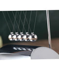 Z Shape Desktop Pendulum Balls Toy For Newtons Cradle Learning Five Ball Physics Experiment Kit reflecting light on desk surface