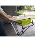 Badass 7 Inch Portable Wet Tile Saw With Tough Stainless Steel Table And Smooth Miter Guide For Quick Ceramic Cutting Certified Refurbished Rig with hands on the surface.