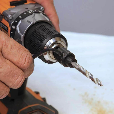 Klein Tools 31905 hole saw arbor with adapter, 3/8-inch, mounted on an orange cordless drill