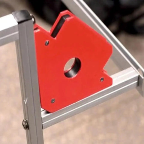 Check Out This Crazy Cool 6Pc Magnetic Welding Fixture Tool For Super Stable Support And Precision Positioning On All Your Soldering Jobs Without Deformation Woes. Red magnetic holder positioned on frame.