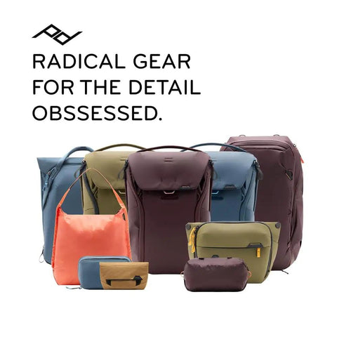 Variety of colorful travel bags and pouches with text 'Radical Gear for the Detail Obsessed' displayed in background.