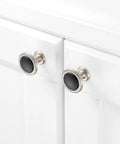 Round Cabinet Knobs 10 Pack Matte Black And Nickel shown on white cabinet doors, modern solid metal design for kitchen and bath decor.