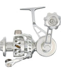Beefed Up Bailless Spinning Reel In Silver VS50SX2 Style Saltwater Ready, high capacity line visible, side view, pro grade gear.