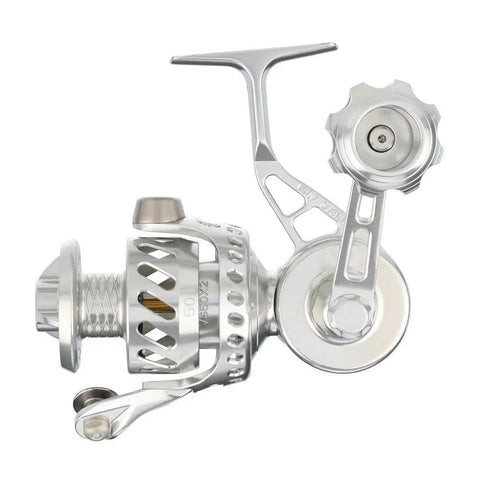 Beefed Up Bailless Spinning Reel In Silver VS50SX2 Style Saltwater Ready, high capacity line visible, side view, pro grade gear.