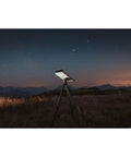 Smartphone Based Telescope Ultimate Pack With Interactive Sky Map And 30mm Aperture set up for stargazing at night in a field.