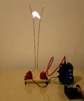 Mini DC Induction Jacobs Ladder High Voltage Arc Tesla Coil Kit for DIY enthusiasts in action, showing arcing effect.