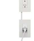 White In-Wall Power Outlet Relocation Kit 6 Foot In-Wall Outlet Extender For Kitchen Remodel DIY Friendly Cable Management And Clean Hidden Wiring Solution featuring two white wall plates connected by a cable