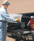 Person using Portable Mini Metal Brake 48 Inch 22 Gauge Capacity Bends Up To 135 Degrees for sheet metal on truck bed