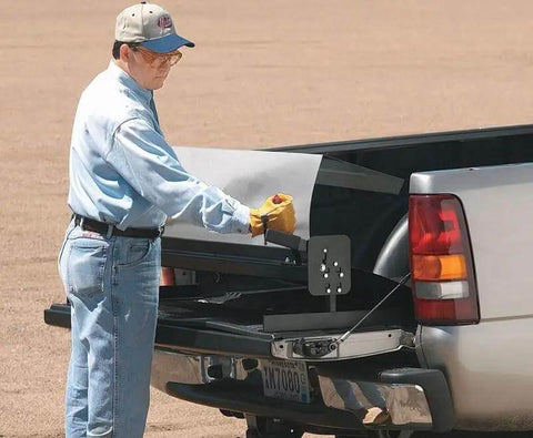 Person using Portable Mini Metal Brake 48 Inch 22 Gauge Capacity Bends Up To 135 Degrees for sheet metal on truck bed