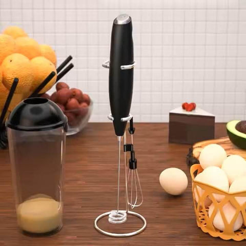 Automatic Milk Frother Wand for Lattes and Cappuccinos, Battery Operated Handheld Foam Maker on kitchen counter with fruits