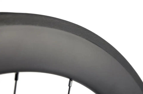 Close-up of Road Ready Turbo Carbon Wheelset 38 50 60 88mm for 700c clincher, 23mm wide UD matte finish, aero rim edge detail.