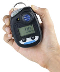 Front view of handheld NH3 ammonia gas monitor in black with digital display and blue sensor dial