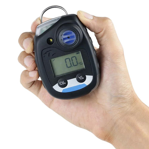 Front view of handheld NH3 ammonia gas monitor in black with digital display and blue sensor dial