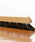 Top Shelf Replacement Broom Head For BR314 Flex Handle featuring sturdy pet and horse hair bristles on hardwood floor.