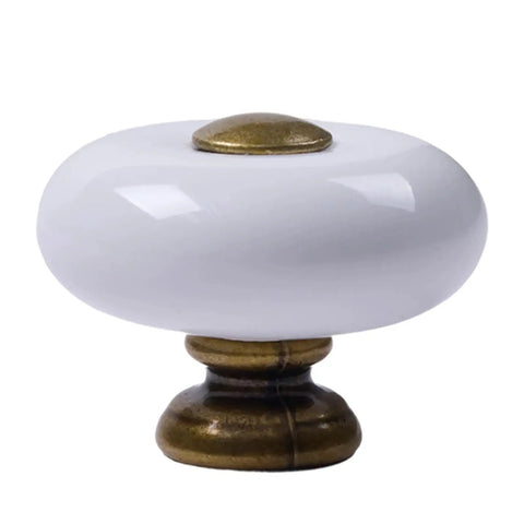 Slick Round Ceramic Cabinet Knobs With Antique Brass Base, Old School Drawer Pulls For Dressers And Closets, Chip Resistant White Glaze close-up.